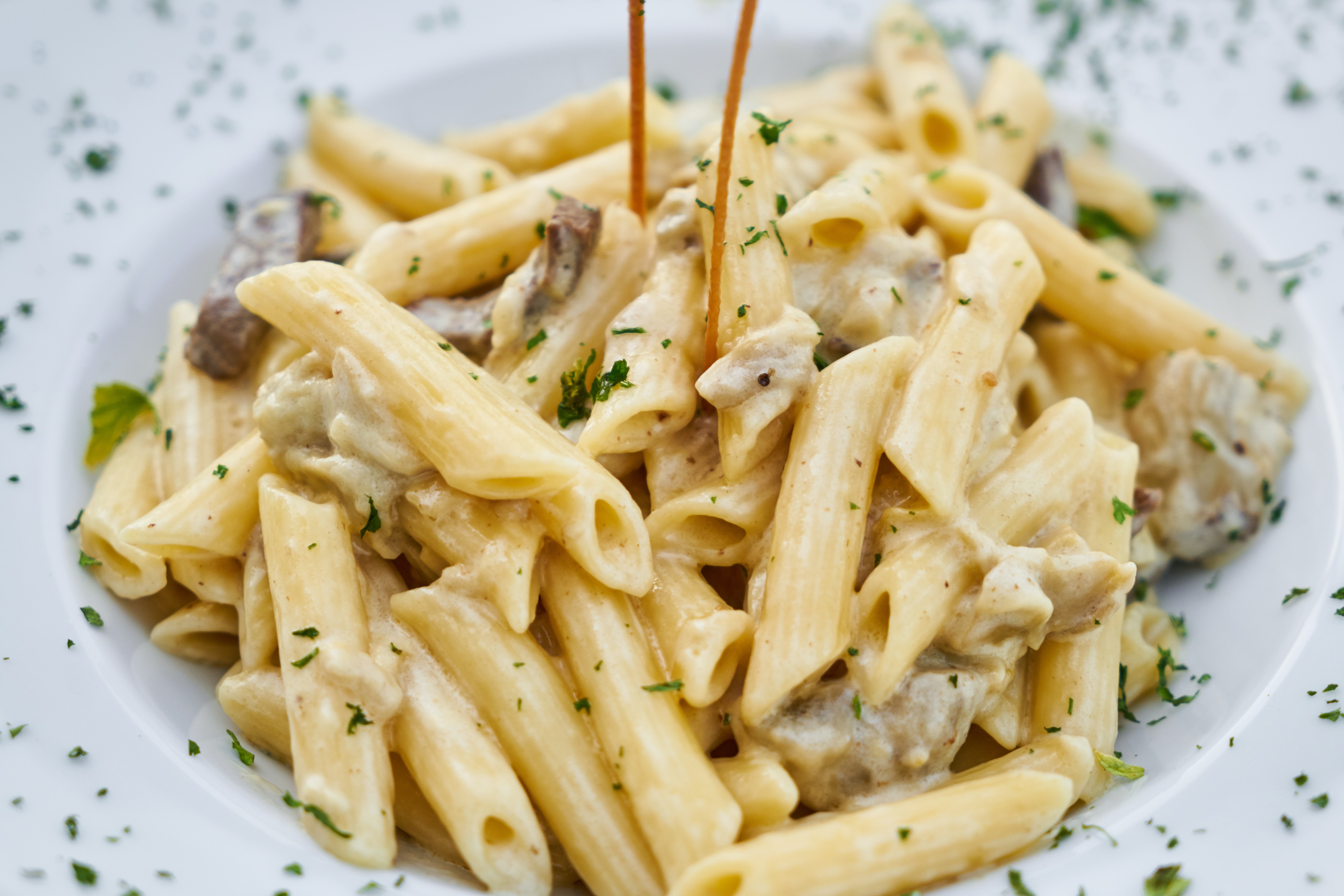 A pasta carbonara dish with cream